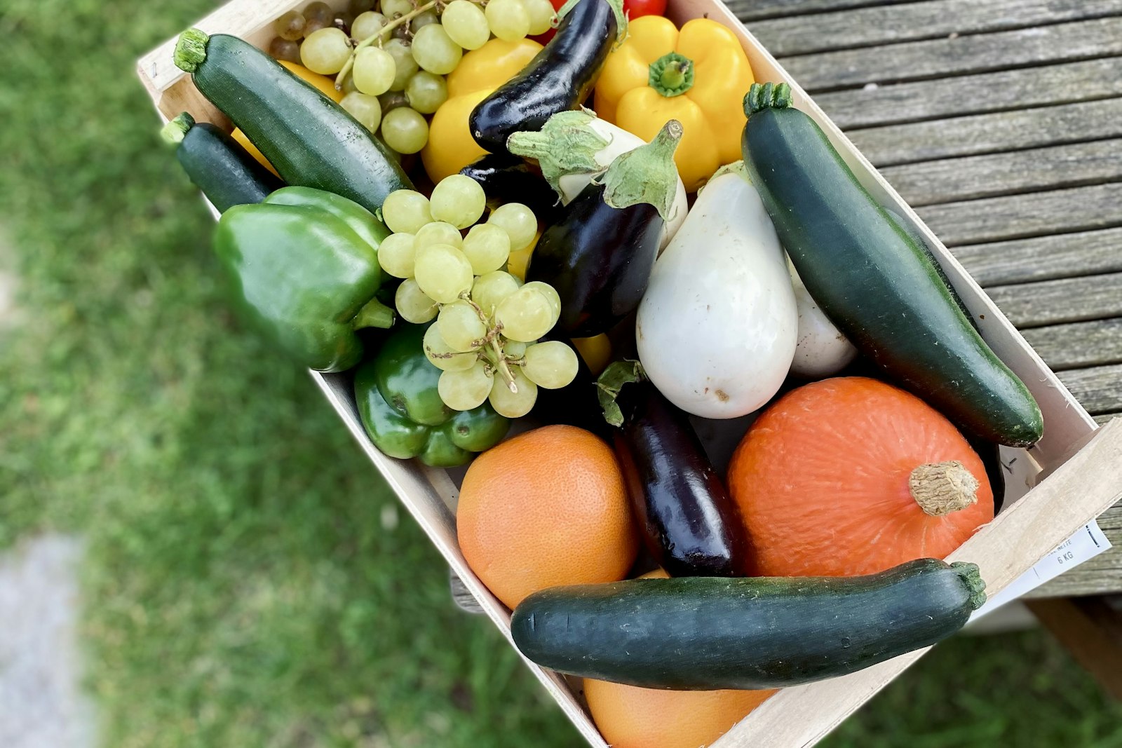 Wooden crate of fresh fruit and vegetables